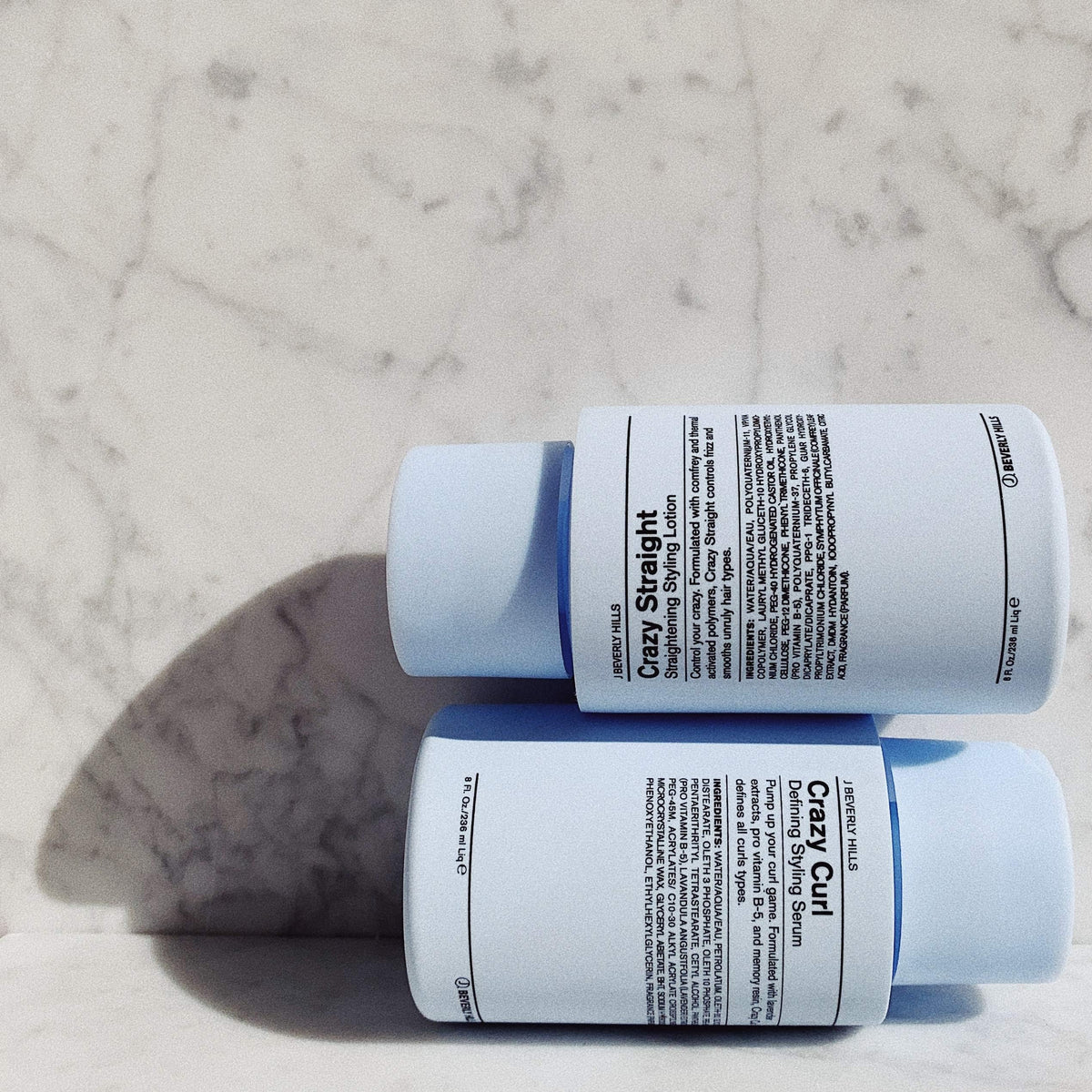 Close-up of J Beverly Hills lotion on hair strand, highlighting smoothing and shine