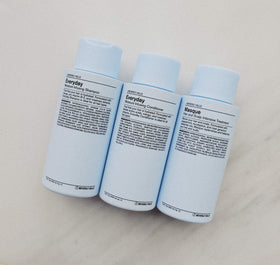 Foamy lather of J Beverly Hills shampoo on hair demonstrating gentle cleansing benefit
