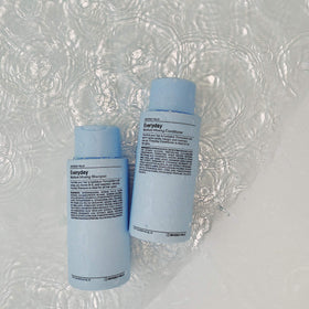 Close-up of J Beverly Hills label showing ingredients like jojoba and castor oils benefit clarity