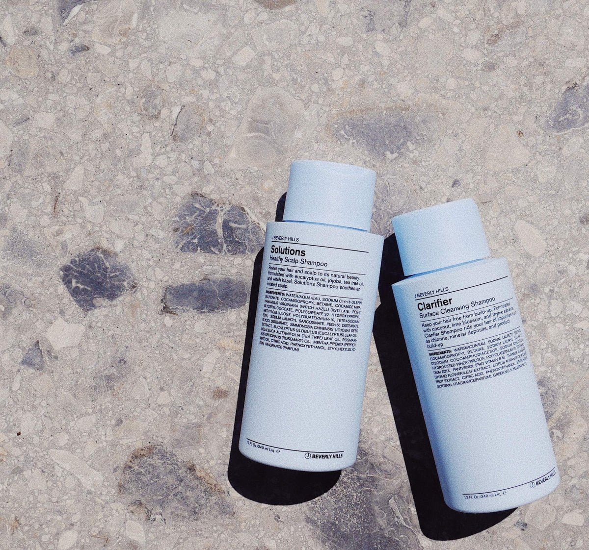 J Beverly Hills label close-up highlighting tea tree and jojoba benefits