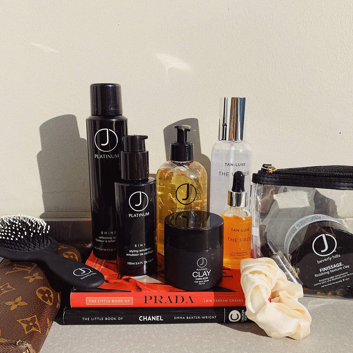 J Beverly Hills styling with flat iron illustrating heat protection and smoother results
