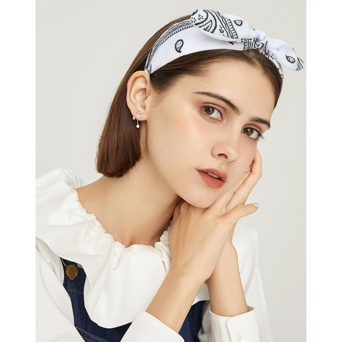 Jaciya headband worn with ponytail demonstrating secure comfortable hold