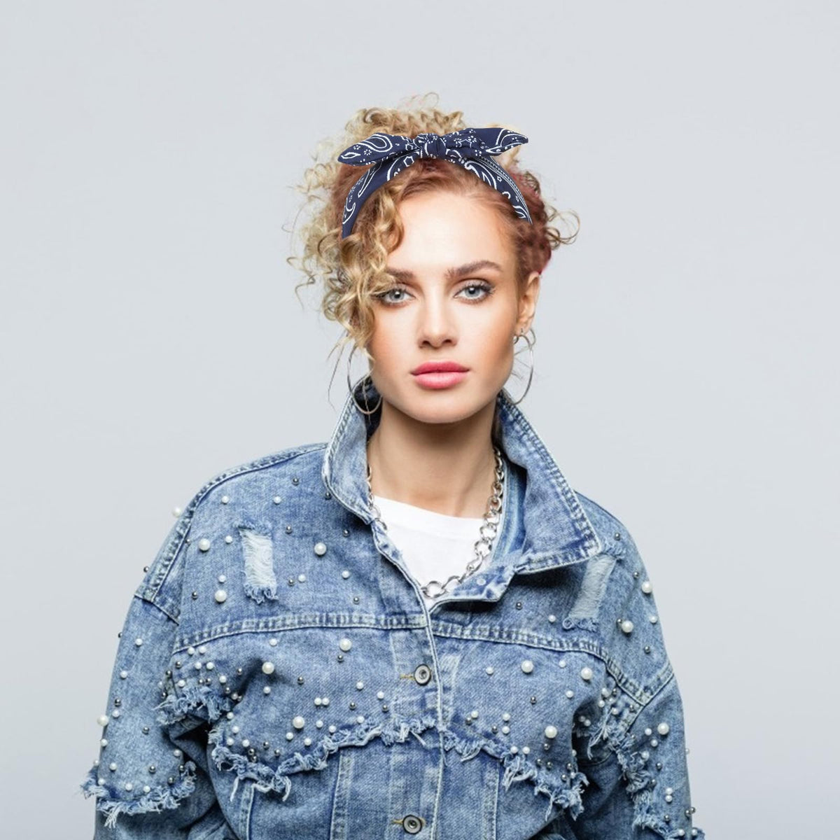 Jaciya headband on hand to show scale and easy portability benefit