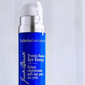 Jack Black application demonstration with fingertip patting eye area to reduce puffiness and lines