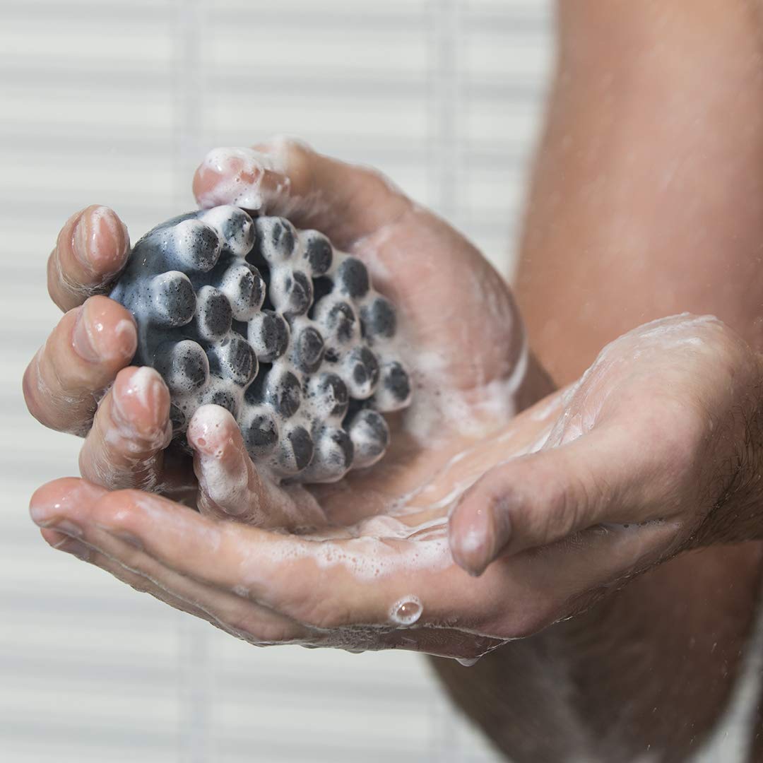 Jack Black close-up of raised nubs and jojoba beads, highlights gentle massage benefit