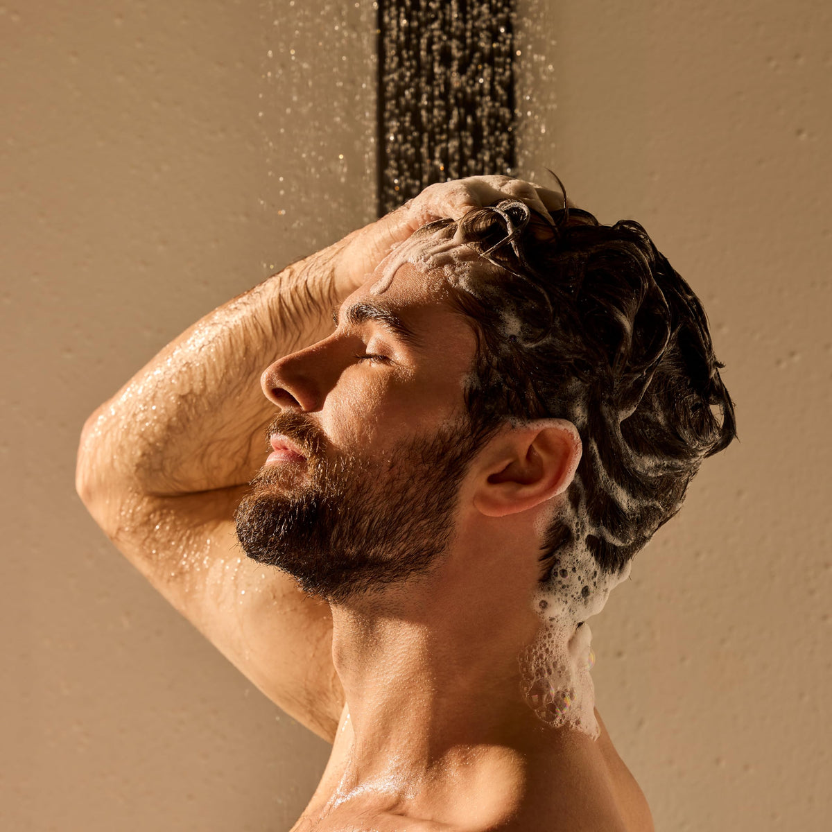 jack black creamy lather in hand demonstrating gentle cleansing and detangling benefit