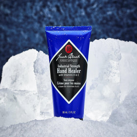 Jack Black hand healer on workbench lifestyle shot for durable hands and quick absorption