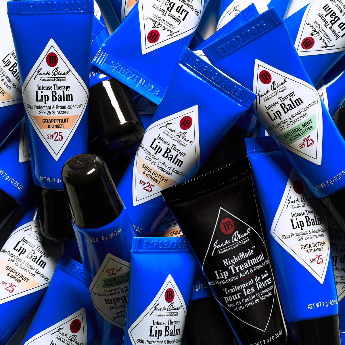 Jack Black lip balm in use outdoors applying SPF protection on lips