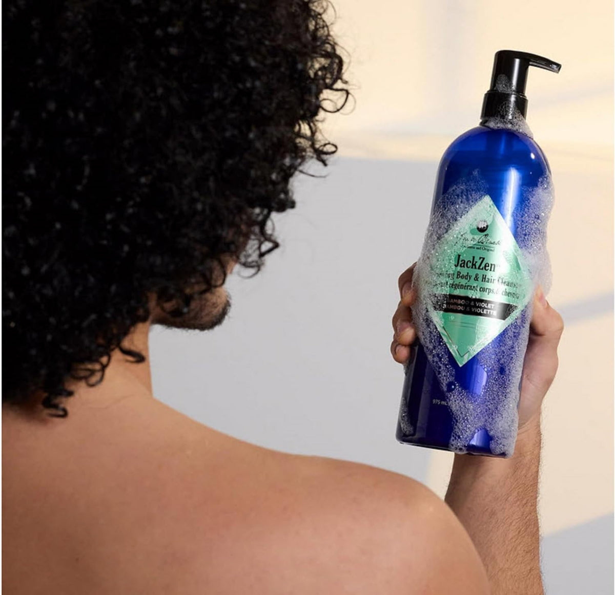 Jack Black in-shower use with hands applying cleanser for convenience