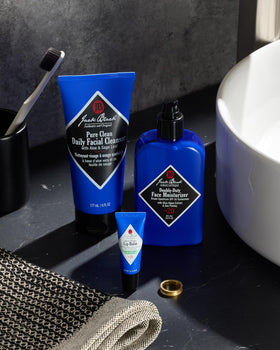 Three Jack Black lip balm tubes together, value pack for daily use