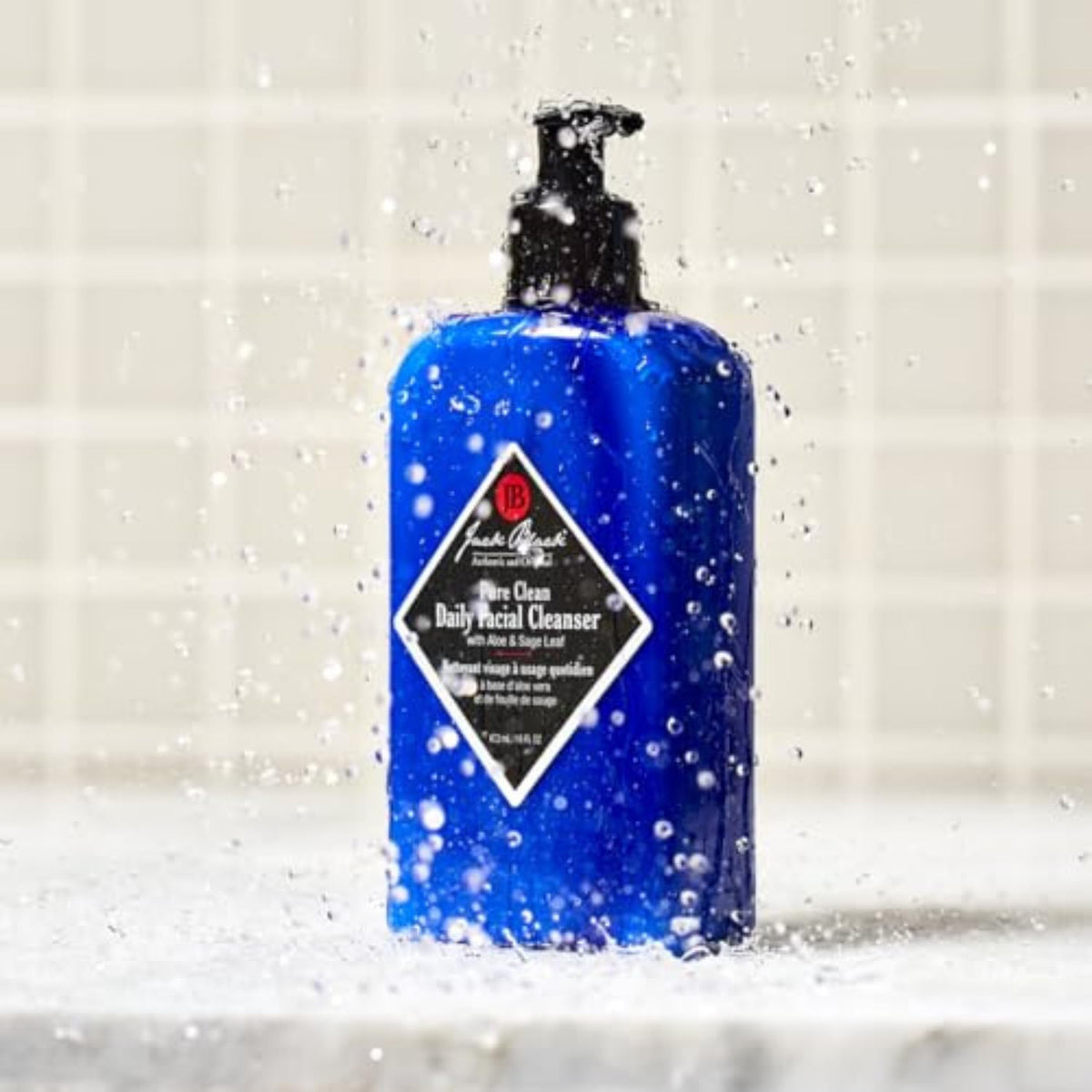 Jack Black next to common toiletry for 16 fl oz size and scale reference