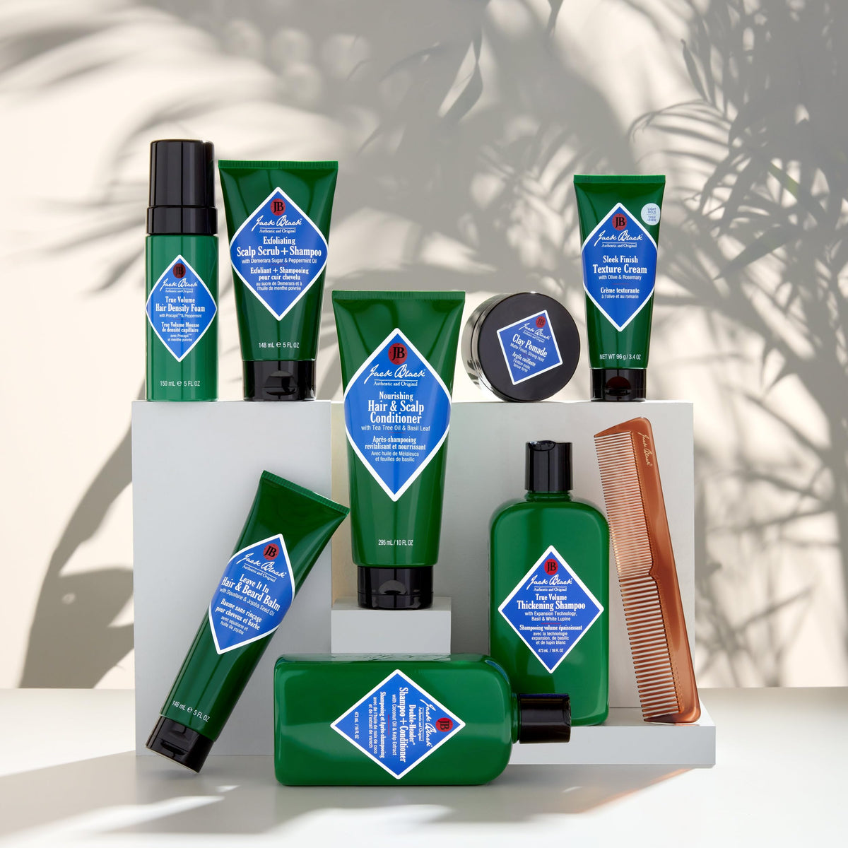 Hand applying Jack Black cream into hair for hydration and anti-frizz manageability