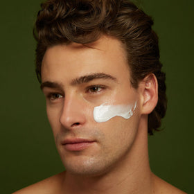 Jackfir applying moisturizer to face demonstrating smooth non-greasy finish