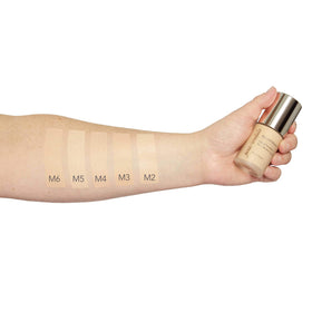 jane iredale in a makeup bag styled on vanity, travel-ready and versatile benefit