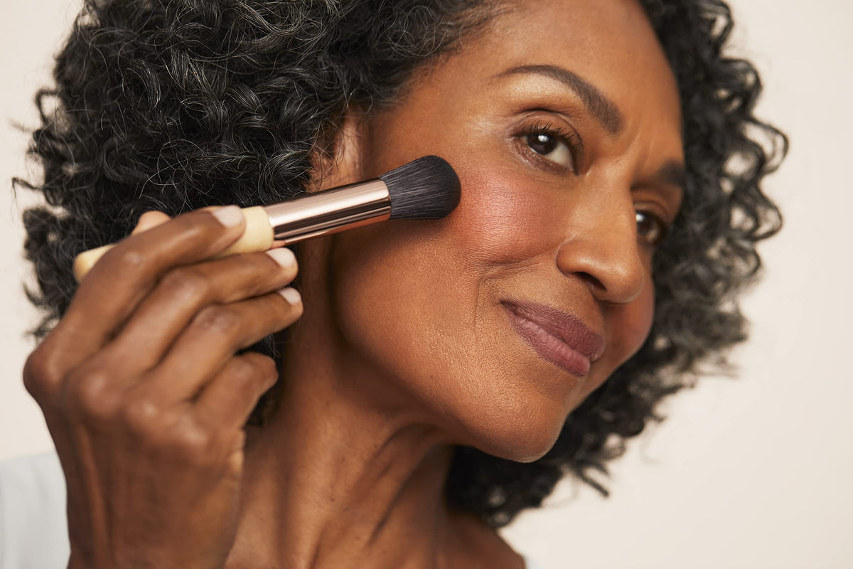 jane iredale brush applying blush for seamless, natural-looking color