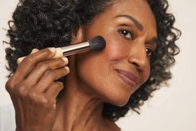 jane iredale brush applying blush for seamless, natural-looking color
