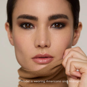 jane iredale stick held in hand to show size and travel-friendly convenience