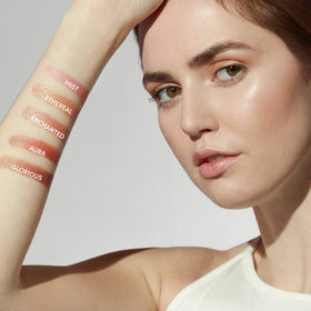 jane iredale stick being applied to cheek demonstrating quick touch-up benefit