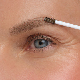 jane iredale product beside ruler showing compact size and travel convenience