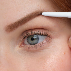 jane iredale pencil on vanity lifestyle scene suggesting polished everyday brows