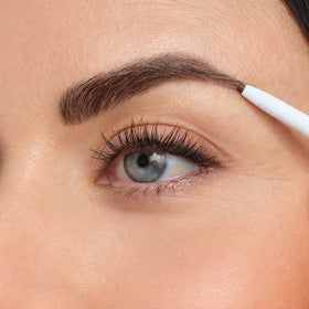 jane iredale lifestyle application model uses pencil to fill and shape brows