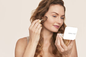 jane iredale arm swatch of PurePressed Base showing coverage and natural matte benefit