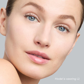 jane iredale product in hand to show size and easy travel convenience benefit