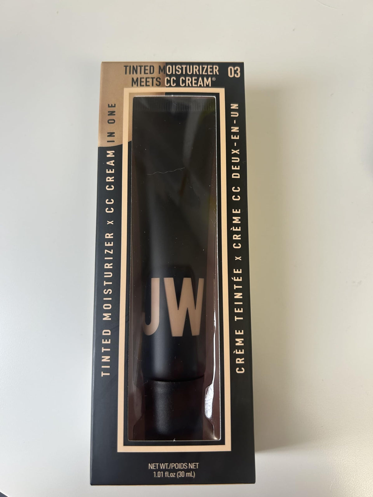 JASON WU tube in a travel bag near a mirror showing everyday convenience and touch-ups