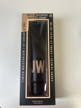 JASON WU tube in a travel bag near a mirror showing everyday convenience and touch-ups