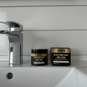 Jaws Podiatry tube on bathroom shelf in lifestyle setting promoting routine use