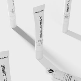 JAXON LANE tube in travel pouch emphasizing portable grooming solution