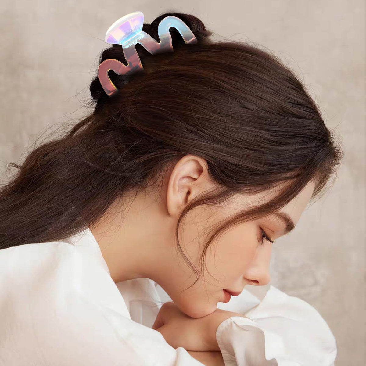 Jayongnee clip worn with beach outfit adding playful iridescent accessory