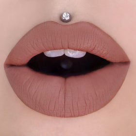 Jeffree Star product next to ruler showing 0.19 fl oz size and portability