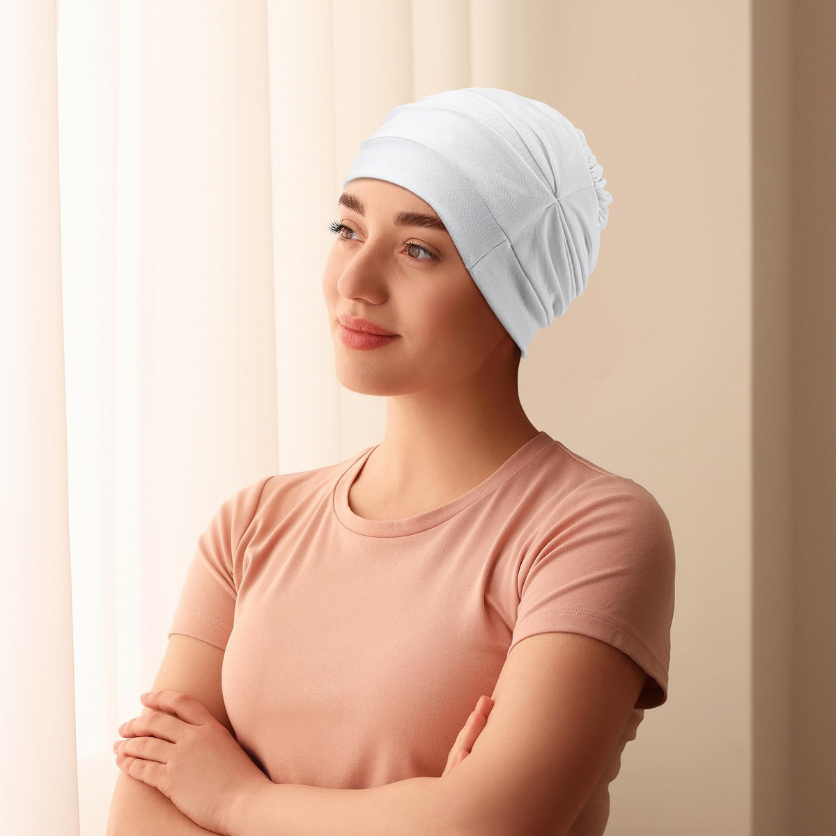 JenPen bonnet size comparison held in hand showing roomy fit for long hair