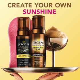 Man and woman using Jergens mousse for an inclusive bronze result