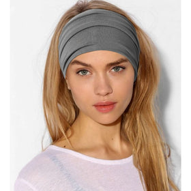 Jesries headband on runner outdoors illustrating sweat-wicking benefit