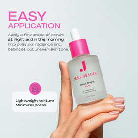 JESS BEAUTY bottle beside coin showing 1 fl oz scale for travel convenience