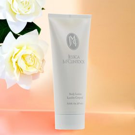 Jessica McClintock applying lotion on arm for smooth, hydrated skin
