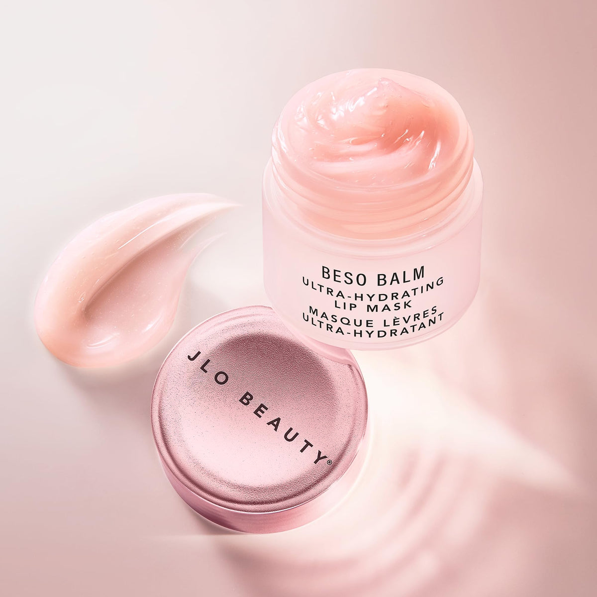 JLO BEAUTY balm placed in bag and on nightstand illustrating day and night use benefit