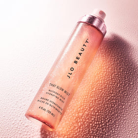 JLO BEAUTY inside a handbag for on-the-go refresh and radiant maintenance