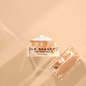 JLO BEAUTY beside ruler showing 0.5 oz scale for travel-friendly benefit