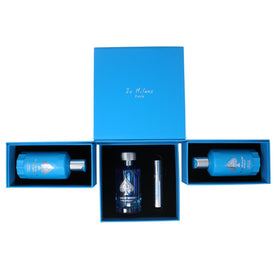Jo Milano refillable atomizer held in hand showing travel-ready convenience
