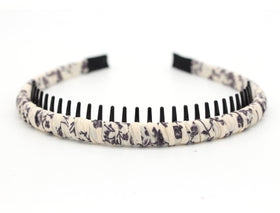 JOBAND headband on a vanity with skincare items to show practical daily use