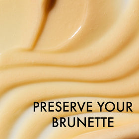 John Frieda conditioner applied on hair showing smoother shiny strands benefit