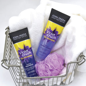 Applying John Frieda conditioner to mid-lengths and ends for improved tone and moisture