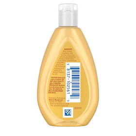 Johnson's Baby bottle next to a boarding pass showing travel-friendly size