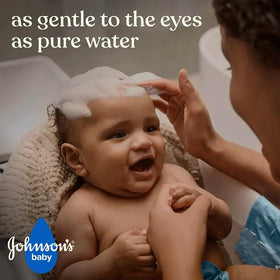 Johnson's Baby shampoo pouring to show light texture and easy rinse benefits