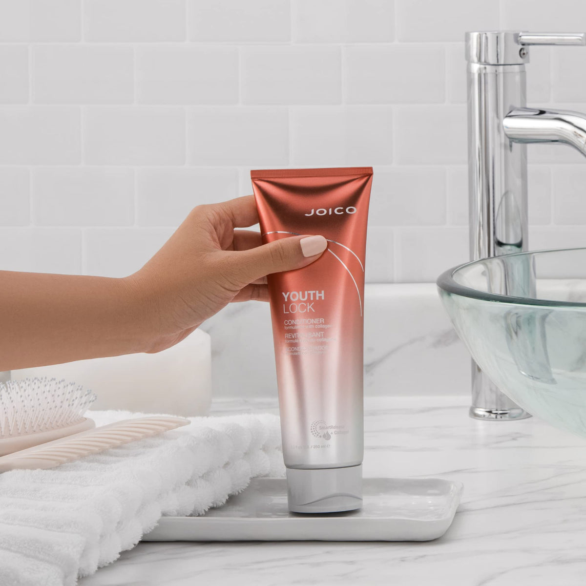 Joico YouthLock conditioner on bathroom shelf in lifestyle scene for daily routine