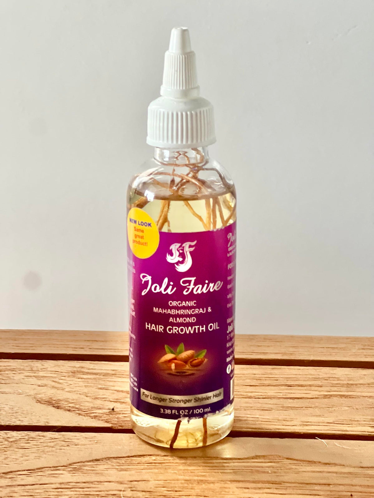Joli Faire oil applied to scalp in-use demonstrating targeted nourishment