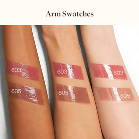 Joocyee gloss beside coin to show compact, travel-friendly size